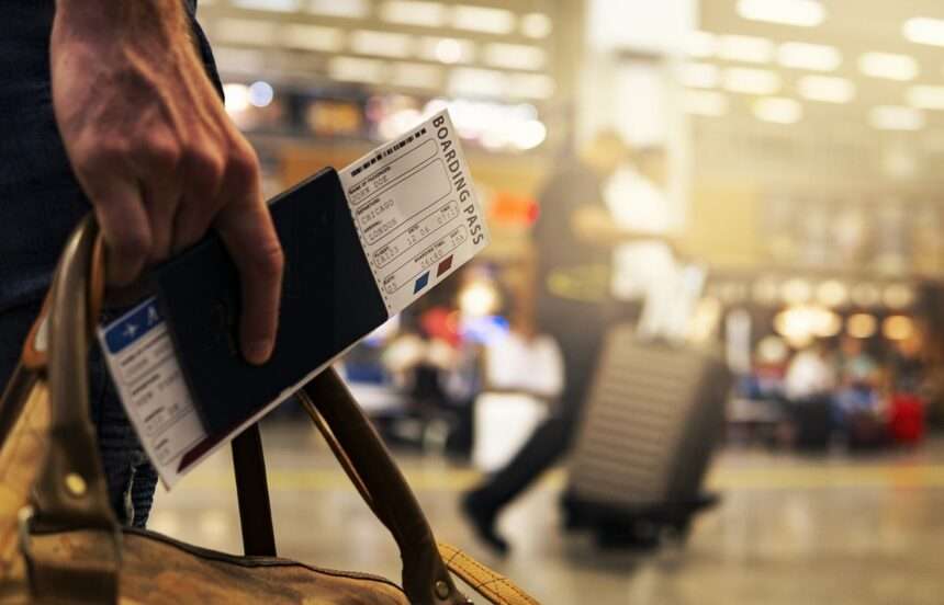 An air traveller with air ticket.