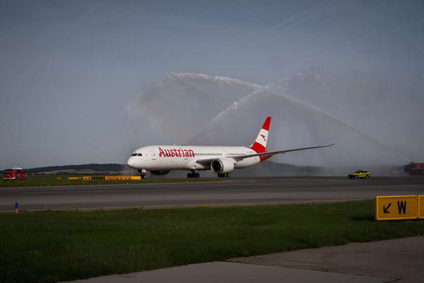 An Austrian Airlines 787 Dreamliner receives a water cannon salute