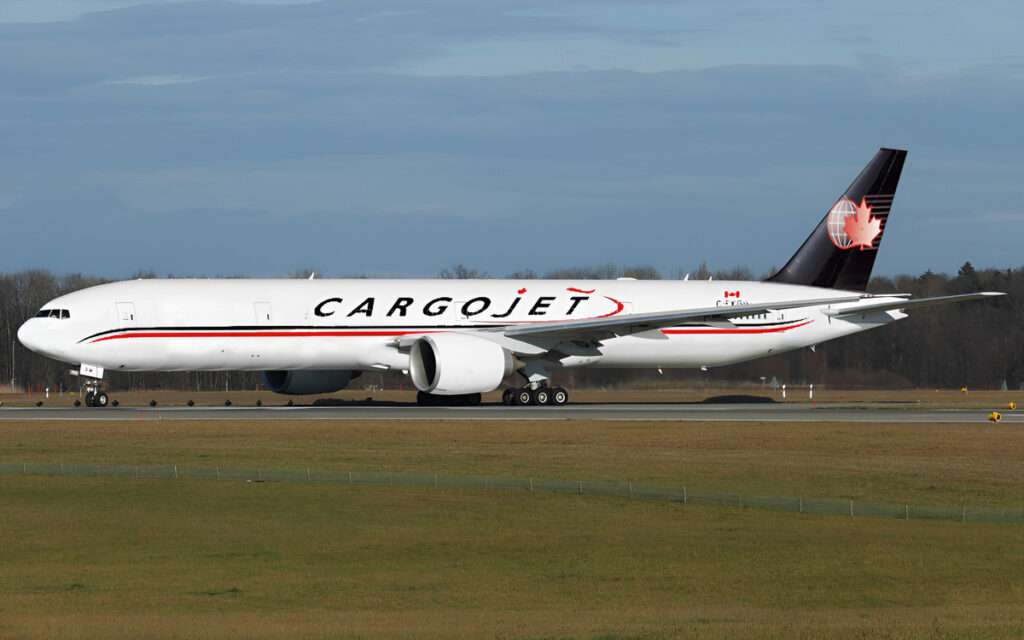 A Cargojet Boeing 777 freighter on the runway.