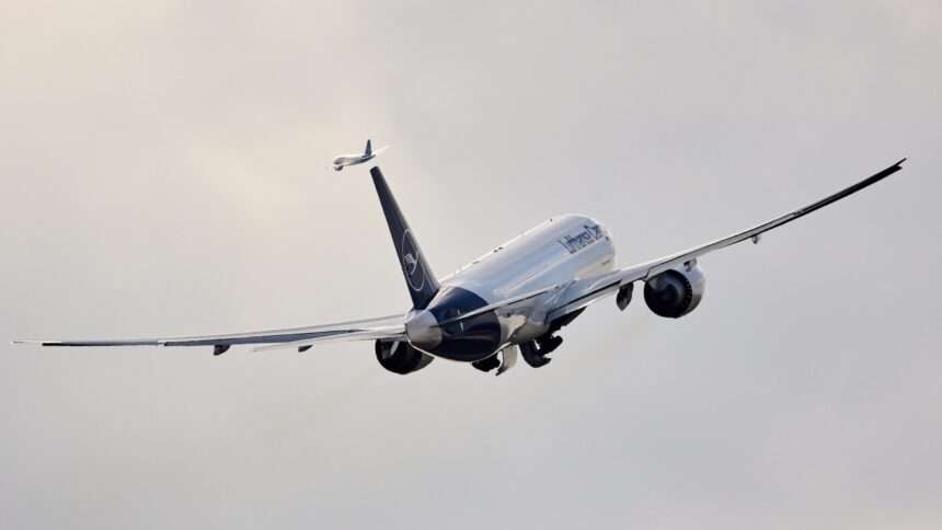 A Lufthansa Cargo freight aircraft climbs after takeoff.