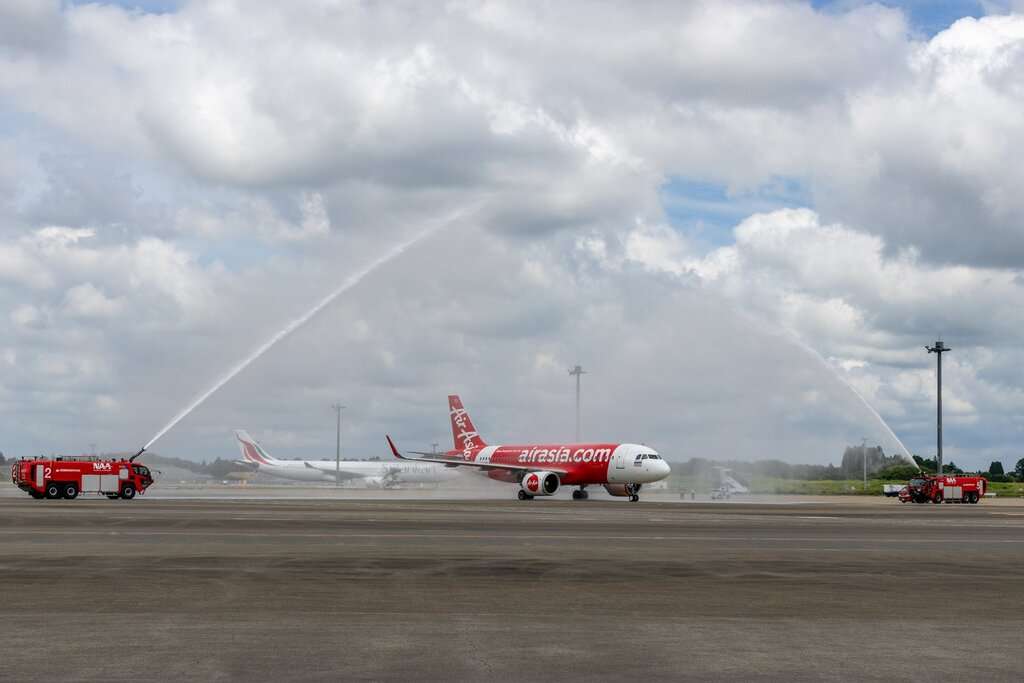 A Thai AirAsia aircraft receives a water cannon salute after conducting a Japan flight via Taiwan