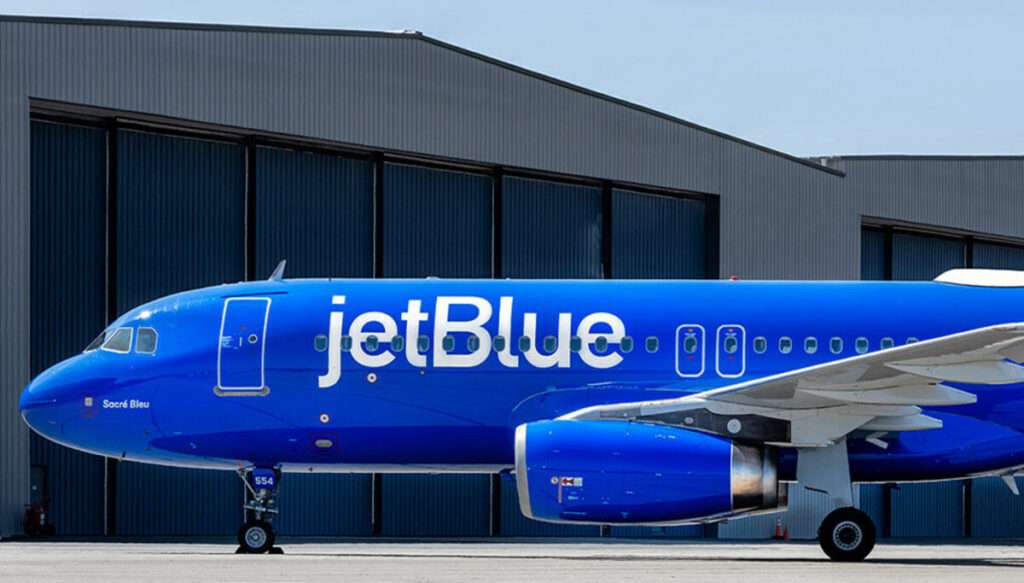 A JetBlue aircraft parked at the hangar.