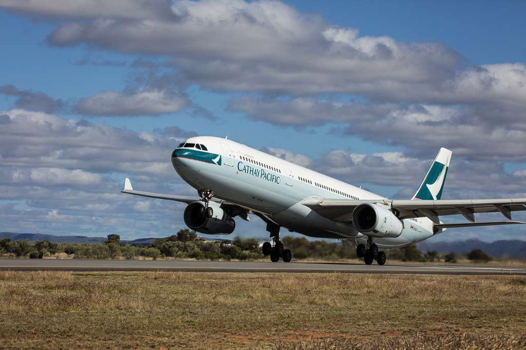 A Cathay Pacific A330 lands after being held in long-term storage.