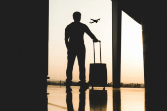 An air traveller stands at an airport terminal