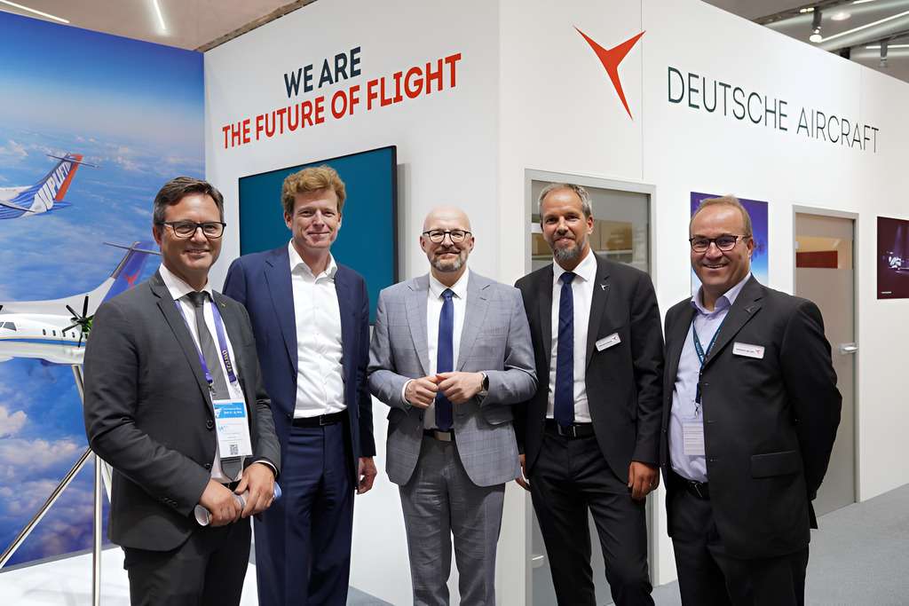 Deutsche Aircraft officials with State Secretary at ILA 2024 Berlin.
