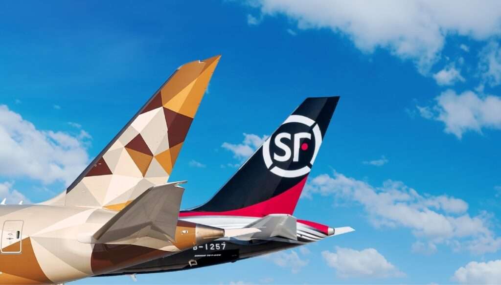 Tailplanes of Etihad Cargo and SF Airlines aircraft together.
