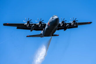 A MAFFS equipped C-130 drops retardant while fighting California wildfires.