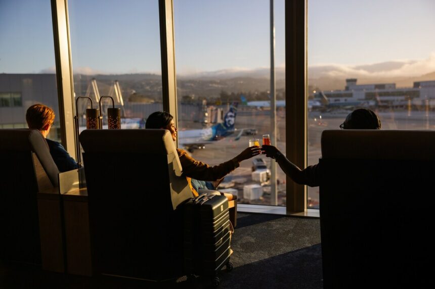 Passenger enjoy the view at Alaska Airlines lounge in San Francisco SFO
