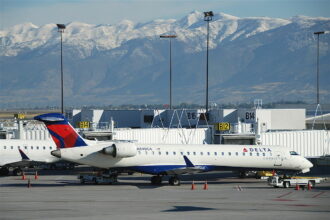 An Endeavour Air/Delta Connection CRJ-700 jet parked on the tarmac.
