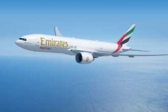 An Emirates SkyCargo Boeing 777F freighter in flight.