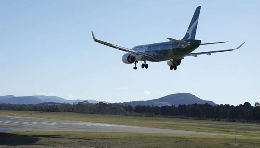 A Qantas A220 lands at Hobart Airport