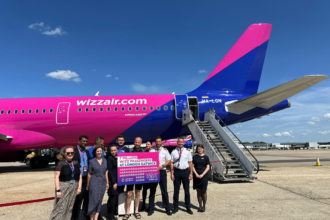 Wizz Air staff celebrate 7 millionth passenger at Gatwick Airport.
