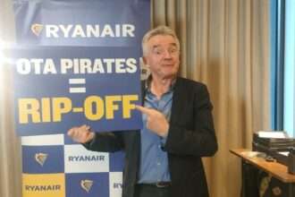 Ryanair CEO Michael O'Leary with an 'OTA Pirate' sign.