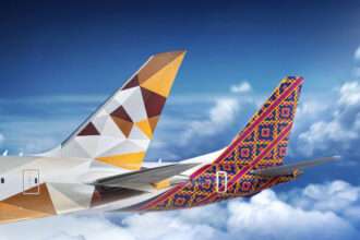 Render of tailplanes of Etihad Airways and Batik Air aircraft together.